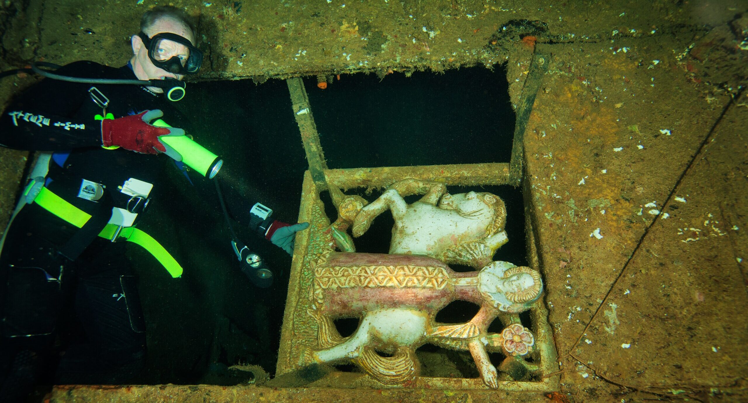 SS President Coolidge – The Lady Statue | Sunreef Vanuatu Dive Trip May 2027 Scuba diver exploring The Lady statue inside the SS President Coolidge shipwreck in Espiritu Santo, Vanuatu, on Sunreef's May 2027 wreck diving expedition.